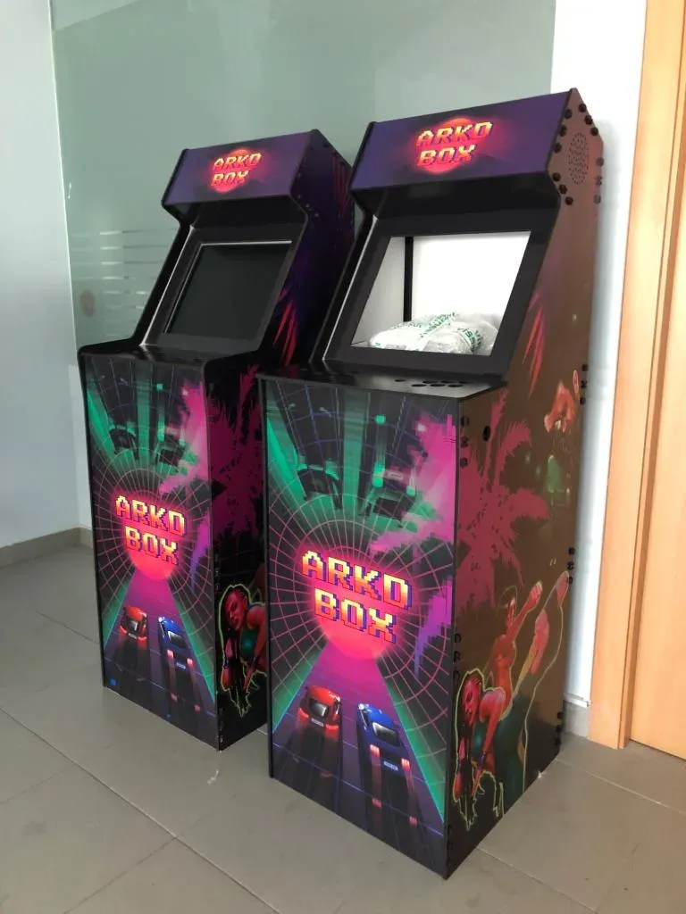 Side art of an ARKD BOX cabinet with neon palm trees